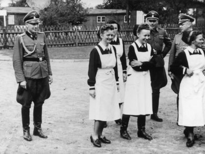 SS officers and German nurses gather during the dedication ceremony of the new SS hospital in Auschwitz.