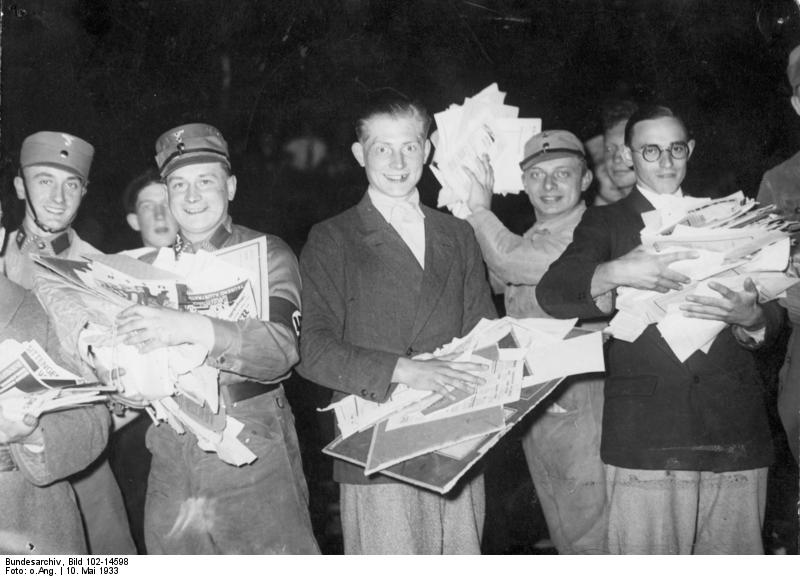 Public burning of un-German writings and books on Opernplatz in Berlin. Students and National Socialists at the Unter den Linden cremation site.